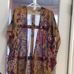 Scarf coverlet in deep golden color. One size fits all